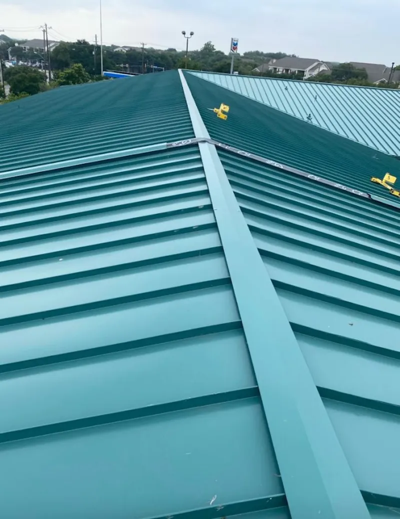 Green commercial metal roof ridge and valley for Metal Roof Repair in Roeland Park