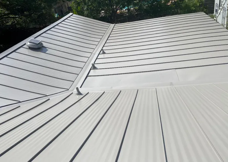 Solar attic fan installed on a metal roof for Roof Ventilation in Roeland Park